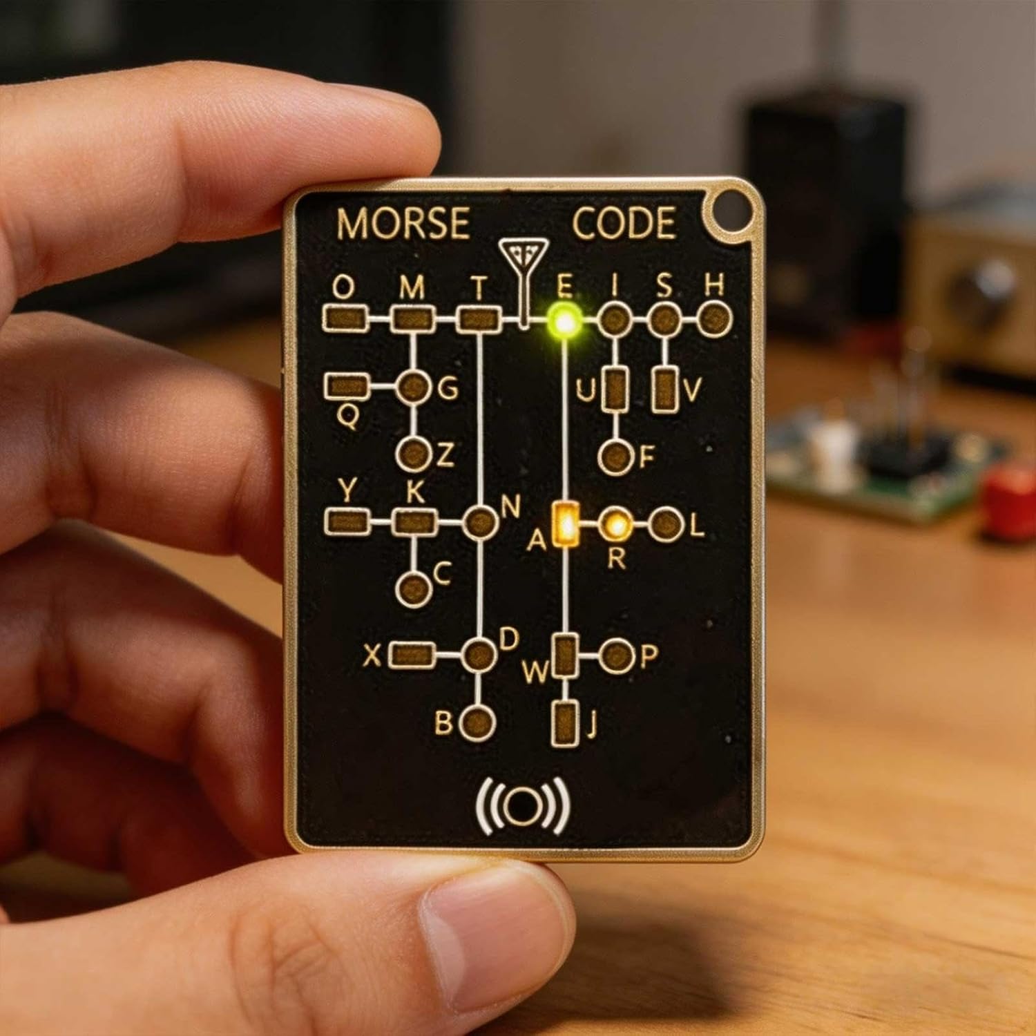 Compact Morse code practice trainer with LED signal mode and built-in alphabet reference chart